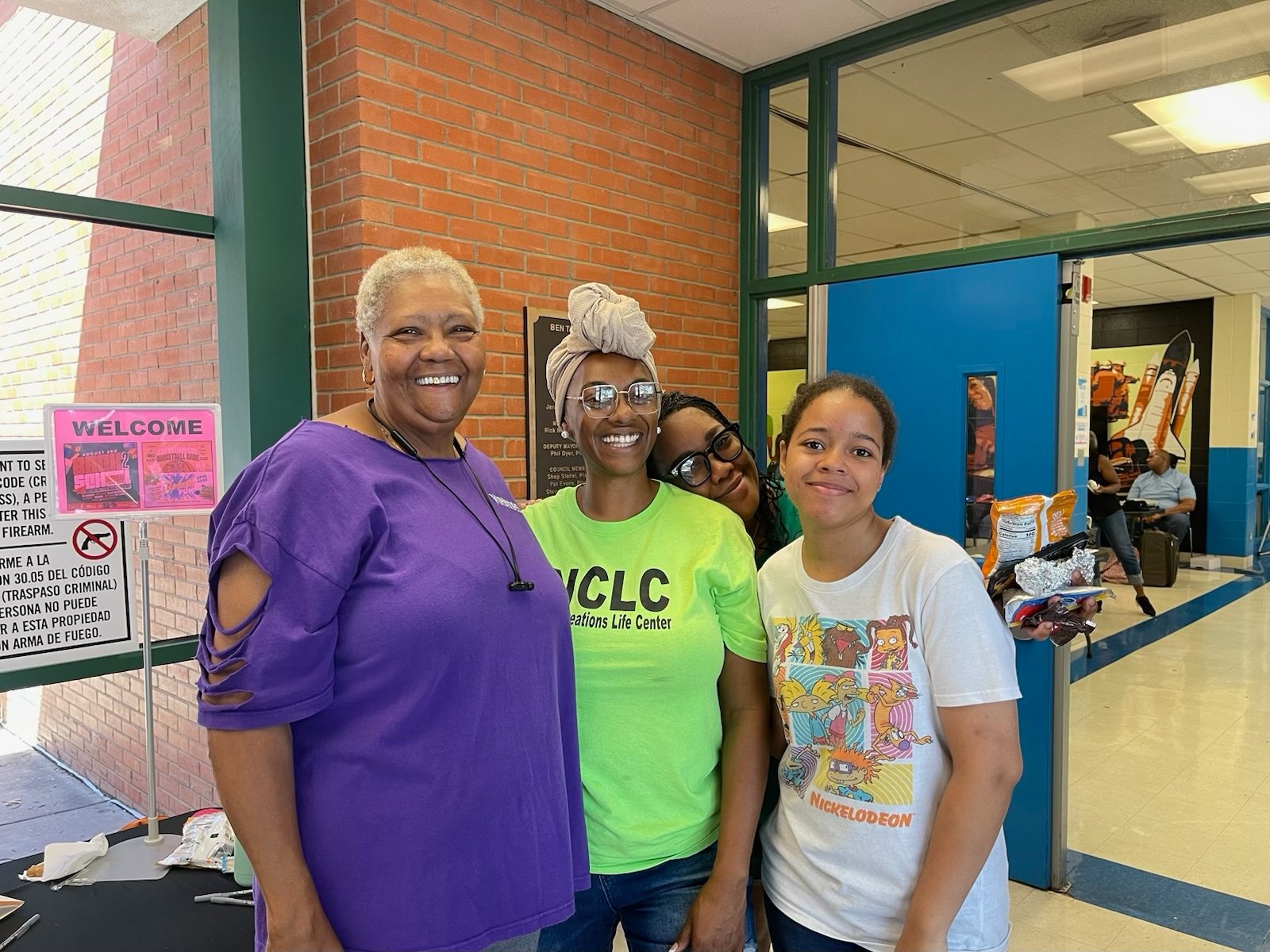 Founder of W.I.N.N.E.R.S with community at an event